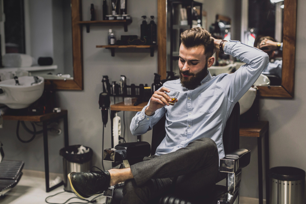 man-with-glass-liquor-barbershop[4450]